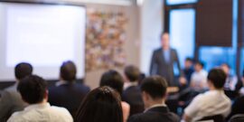 Image of people gathered for presentation